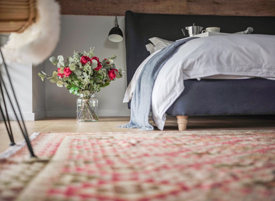 Artificial red rose bouquet on bedroom floor